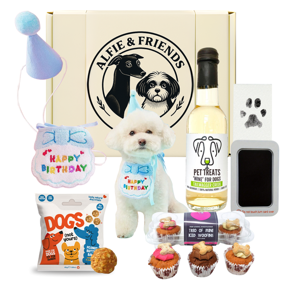Collection of pet products including a bottle of wine, toys, and treats with 'Alfie & Friends' branding - Premium Gift Hamper UK